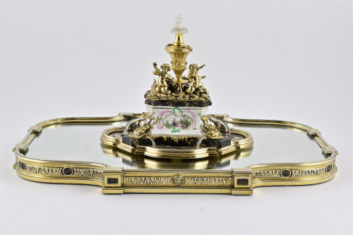A superb antique silver-gilt, porcelain, glass and marble centrepiece on mirror plateau