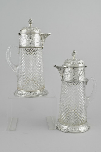 A large Pair of Victorian silver mounted wine jugs