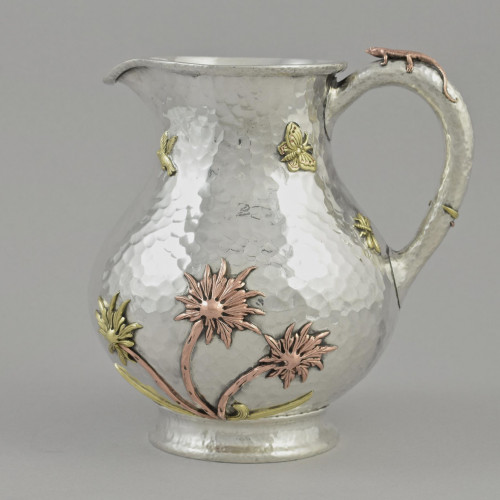 A heavy quality American mixed metal sterling silver pitcher