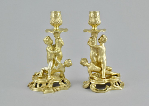 A fine pair of cast silver-gilt candlesticks