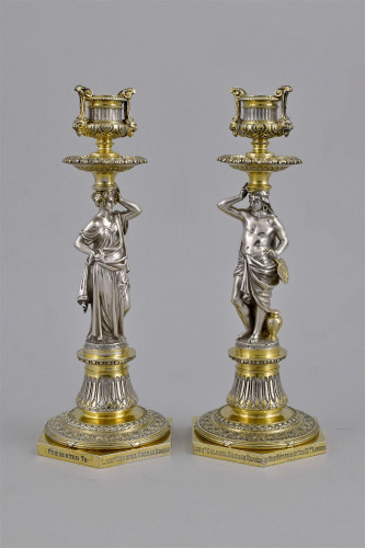 A Fine Pair of Victorian parcel-gilt Silver figural candlesticks.