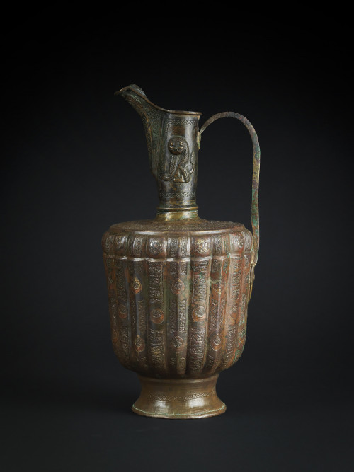 A KHORASAN SILVER AND COPPER INLAID BRONZE EWER, PERSIA, 12TH CENTURY