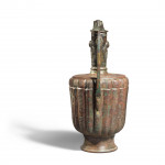 A KHORASAN SILVER AND COPPER INLAID BRONZE EWER, PERSIA, 12TH CENTURY