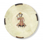 A NISHAPUR SLIP-PAINTED POTTERY BOWL DEPICTING A SEATED FIGURE, PERSIA, 10TH CENTURY
