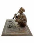 AN ORIENTALIST COLD-PAINTED BRONZE SCULPTURE OF A SNAKE CHARMER, FRANZ XAVER BERGMAN, 20TH CENTURY