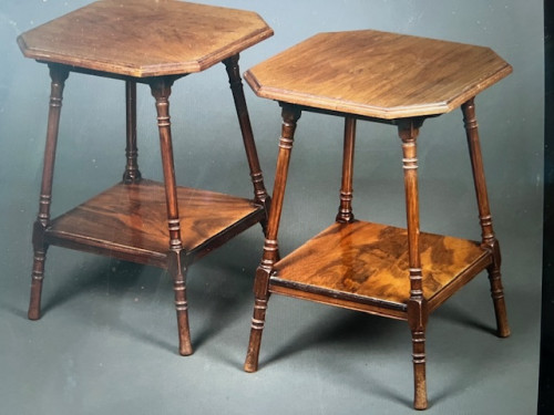 A un-usual pair of Edwardian walnut occasional tables.