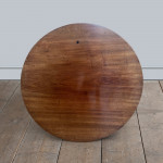 A mahogany occasional table with circular base and scroll feet circa 1835