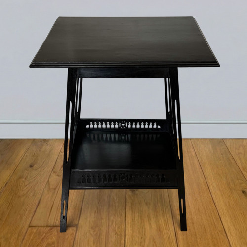 One ebonised walnut  occasional table in the design of James Shoolbred & Co circa 1905