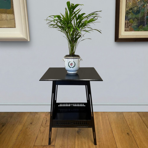 One ebonised walnut  occasional table in the design of James Shoolbred & Co circa 1905