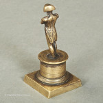 Small Brass Napoleon on plinth