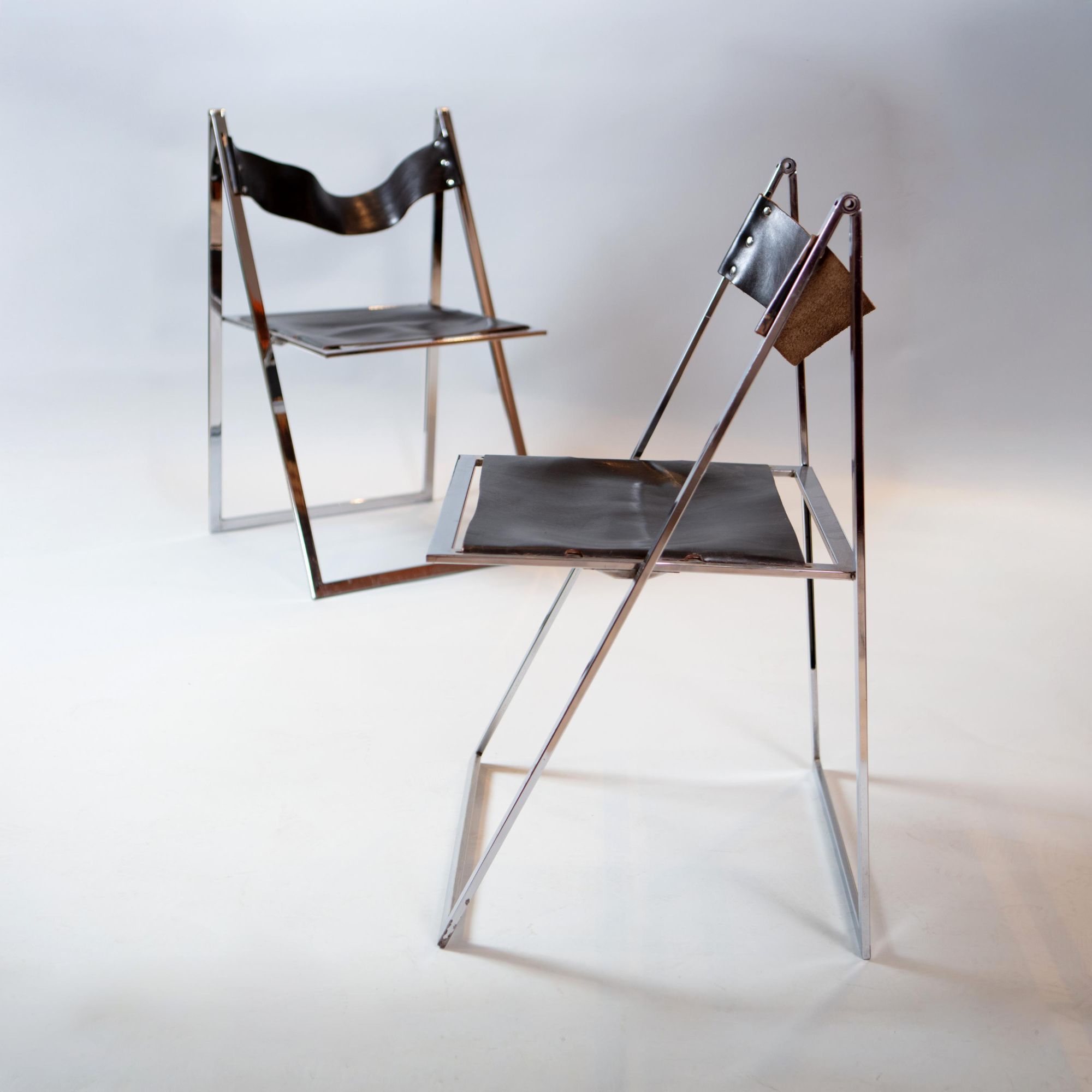 A set of six chrome folding chairs