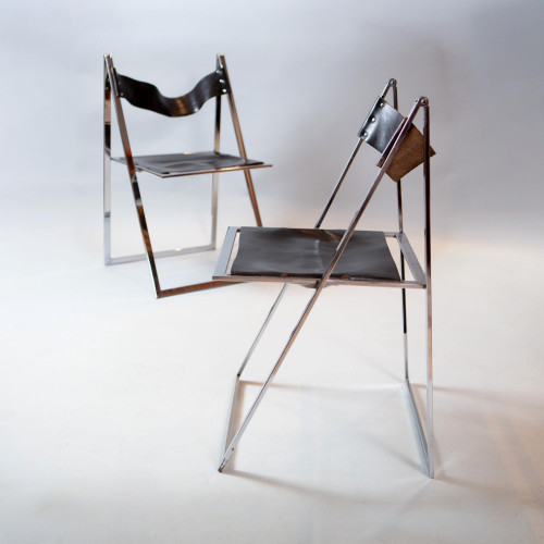 A set of six chrome folding chairs