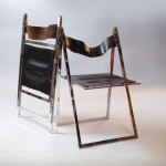 A set of six chrome folding chairs