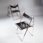 A set of six chrome folding chairs