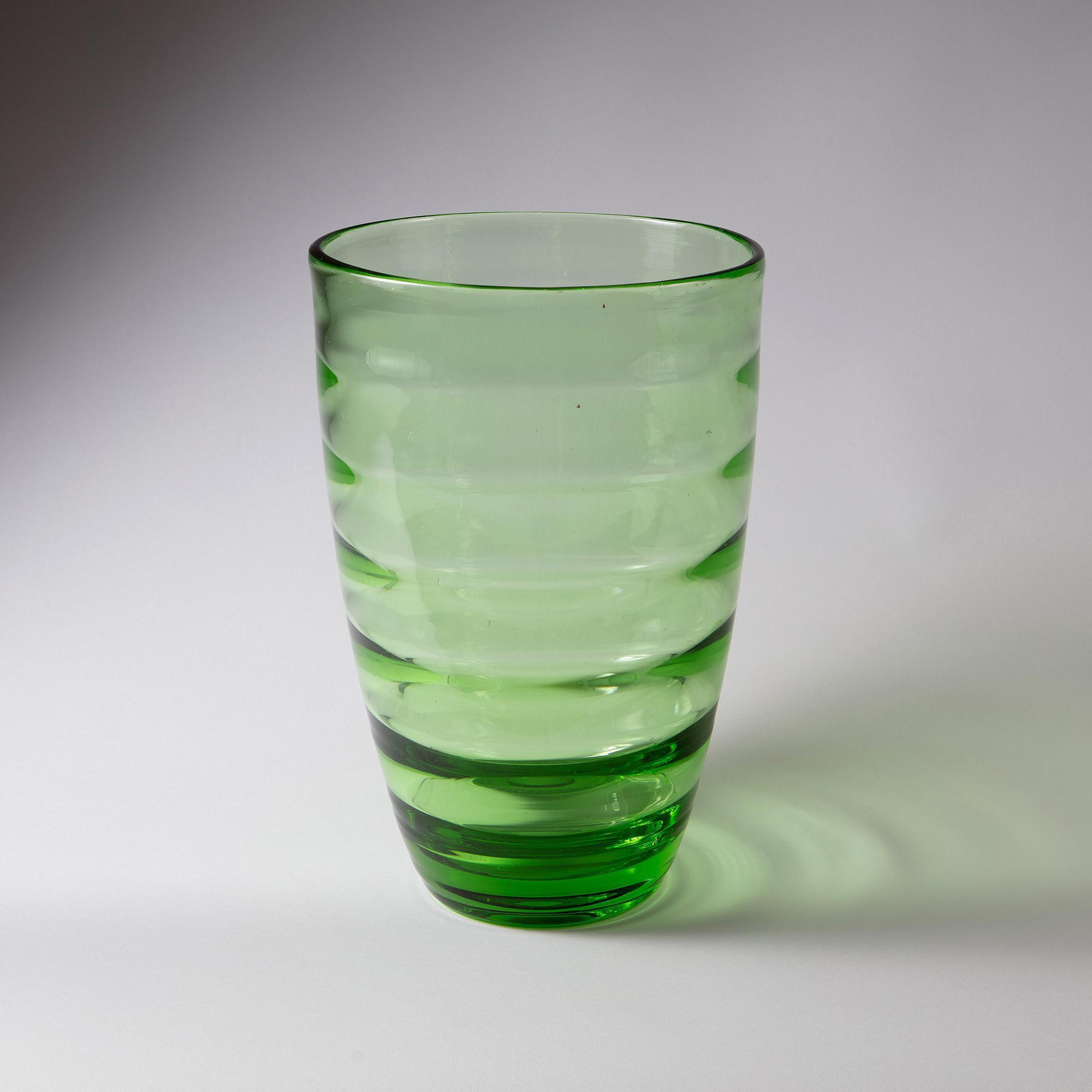 A mid century ribbed green glass vase