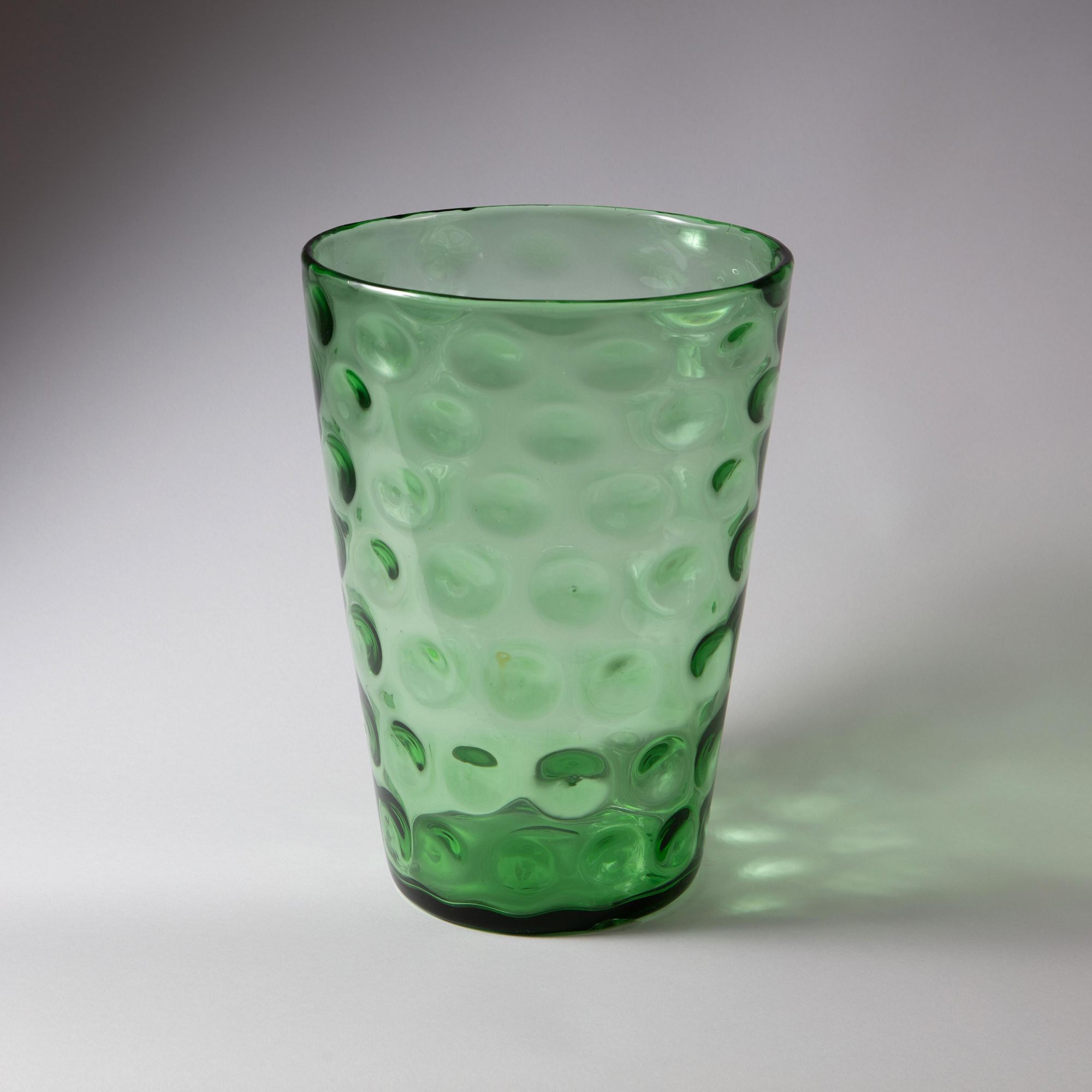 A mid century green glass vase