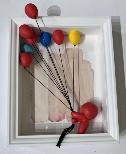 Red character with balloons