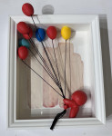 Red character with balloons