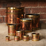 A Rare set of 9 Copper and Brass Seer Measures