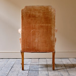 Antique early 20th century wingback armchair