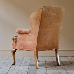 Antique early 20th century wingback armchair
