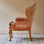 Antique early 20th century wingback armchair
