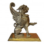 Pair of steel and brass fireside griffins