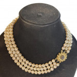 Triple strand of progressing pearls