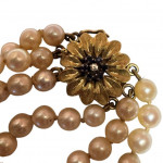 Triple strand of progressing pearls