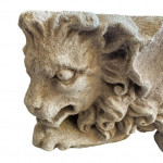 Matched pair of 19th-century Gothic Revival carved limestone winged-beast corbels