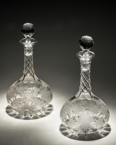 A FINE PAIR OF ENGRAVED SHAFT & GLOBE DECANTERS