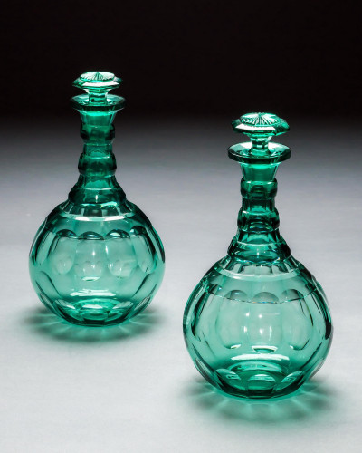 A PAIR OF GREEN SHAFT & GLOBE DECANTERS