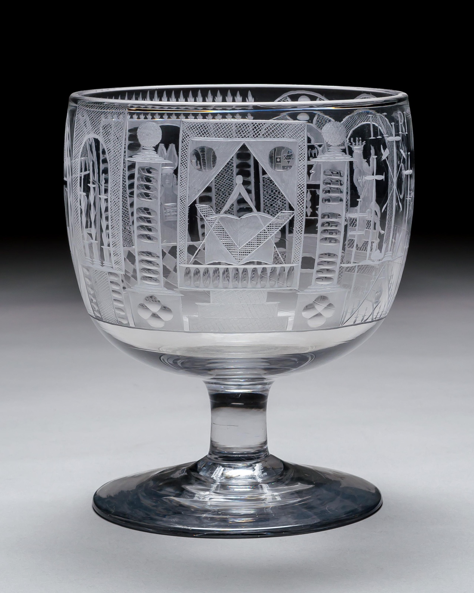 AN ENGRAVED GLASS SERVICE OF MASONIC INTEREST ALONG WITH A COLLECTION OF CORRESPONDING MASONIC REGALIA