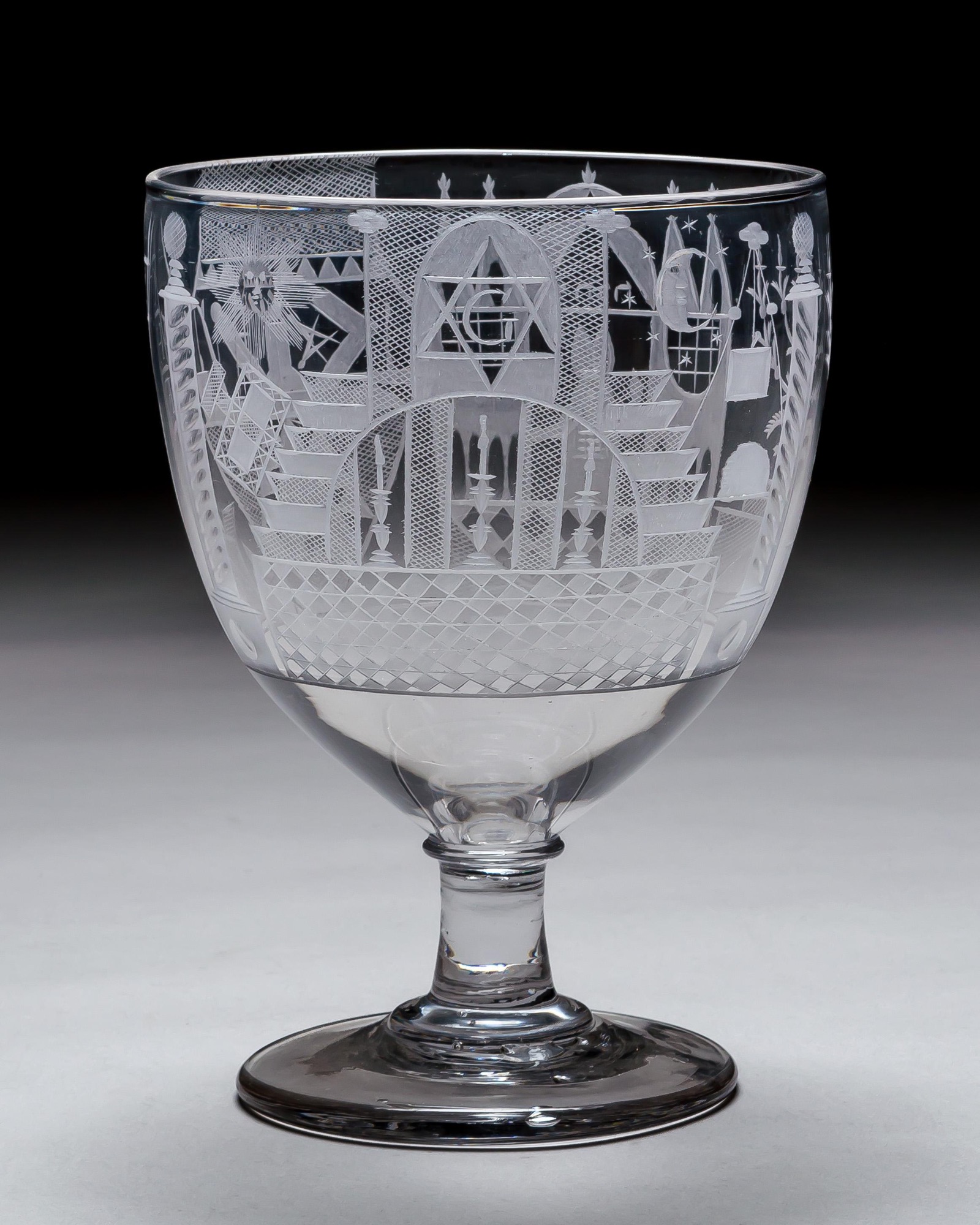 AN ENGRAVED GLASS SERVICE OF MASONIC INTEREST ALONG WITH A COLLECTION OF CORRESPONDING MASONIC REGALIA