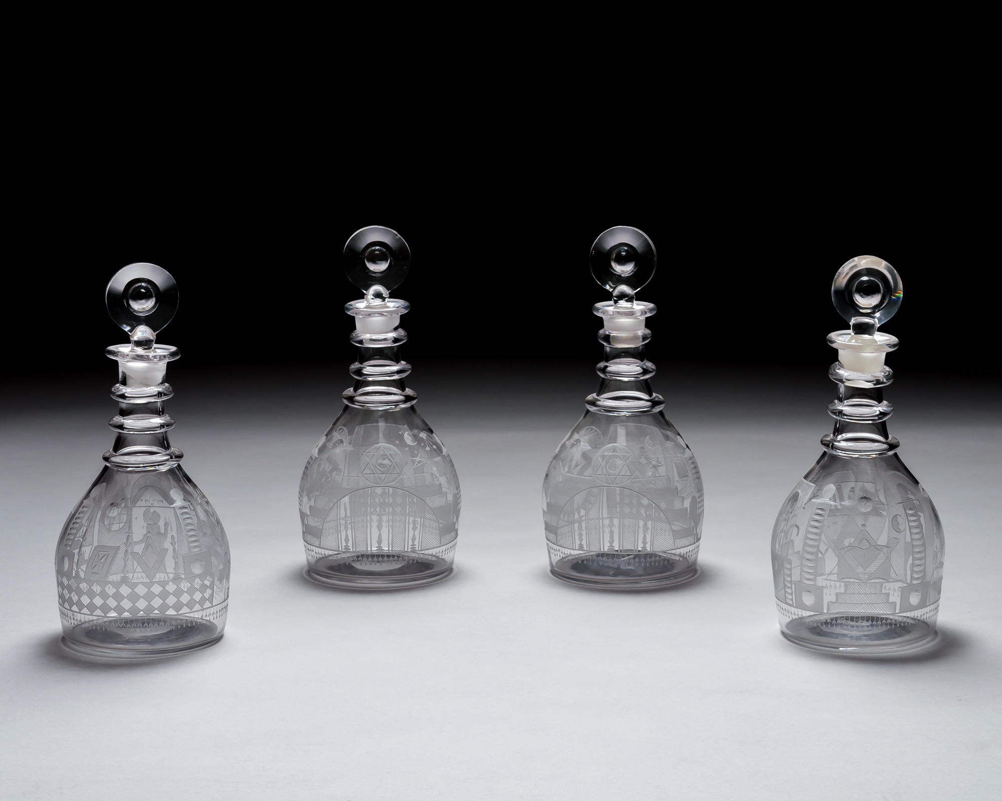 AN ENGRAVED GLASS SERVICE OF MASONIC INTEREST ALONG WITH A COLLECTION OF CORRESPONDING MASONIC REGALIA