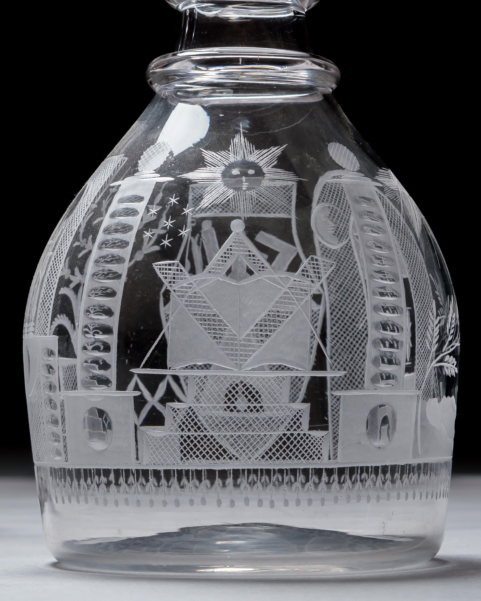 AN ENGRAVED GLASS SERVICE OF MASONIC INTEREST ALONG WITH A COLLECTION OF CORRESPONDING MASONIC REGALIA