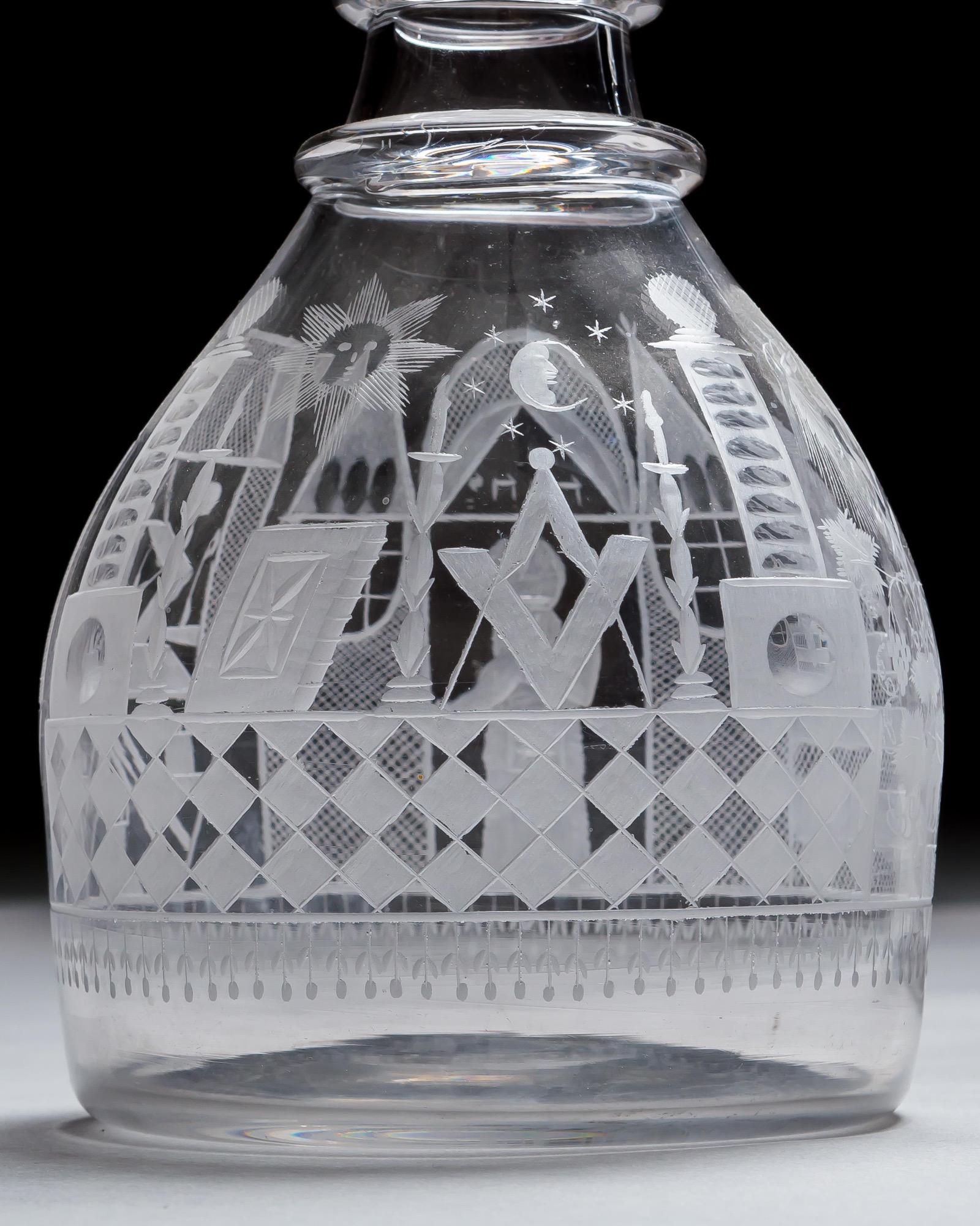 AN ENGRAVED GLASS SERVICE OF MASONIC INTEREST ALONG WITH A COLLECTION OF CORRESPONDING MASONIC REGALIA