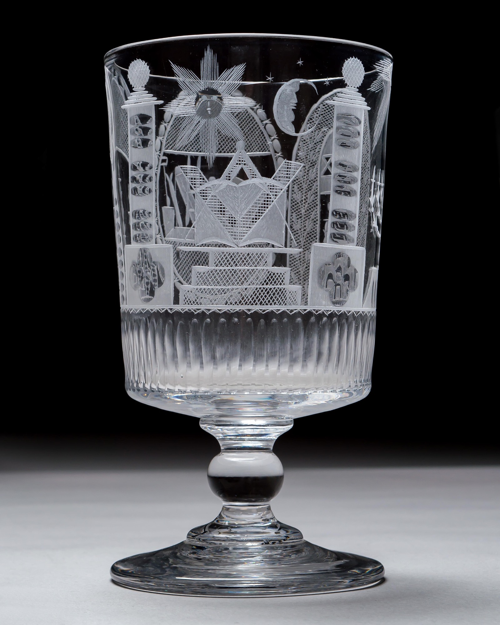 AN ENGRAVED GLASS SERVICE OF MASONIC INTEREST ALONG WITH A COLLECTION OF CORRESPONDING MASONIC REGALIA