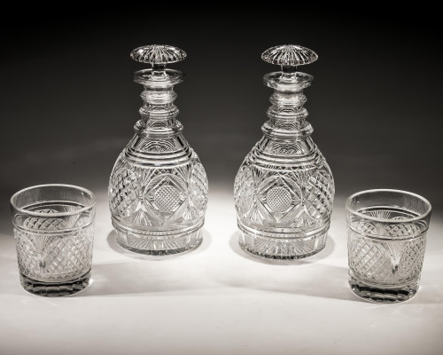 AN EXQUISITE PAIR OF REGENCY CUT GLASS DECANTERS WITH MATCHING TUMBLERS
