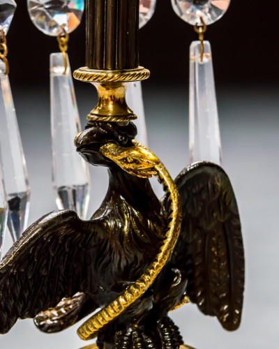 A PAIR OF REGENCY EAGLE CANDLESTICKS