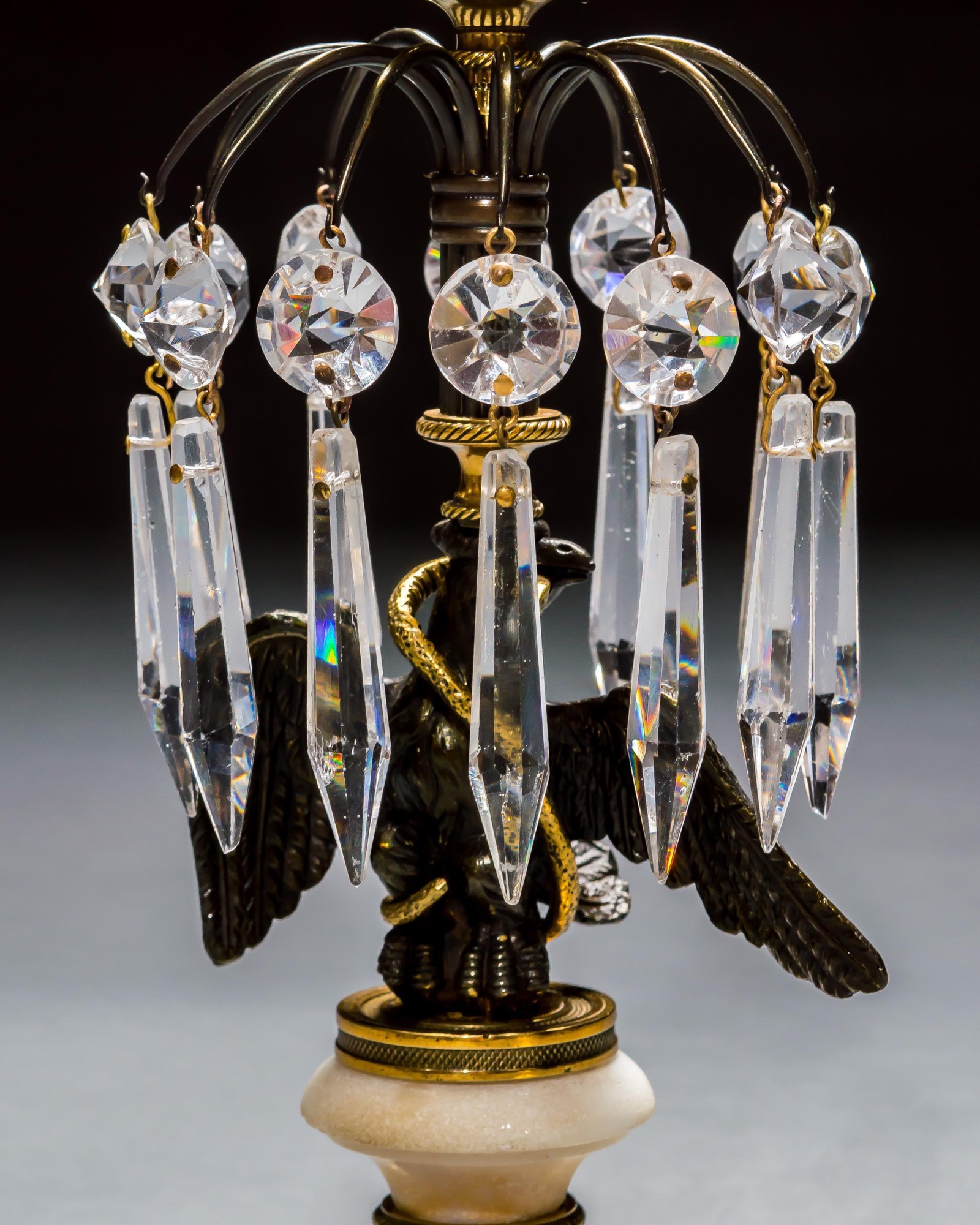 A PAIR OF REGENCY EAGLE CANDLESTICKS