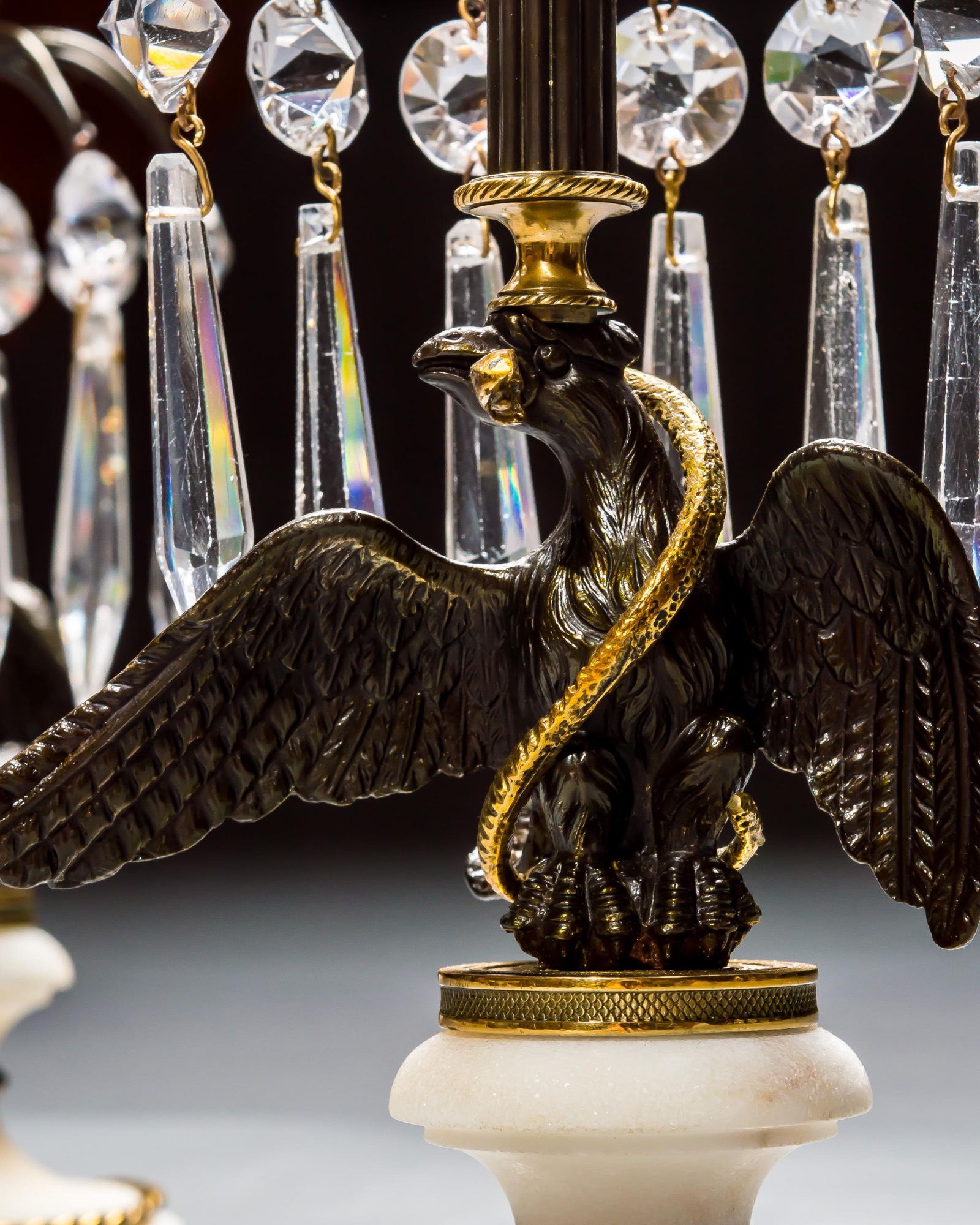 A PAIR OF REGENCY EAGLE CANDLESTICKS