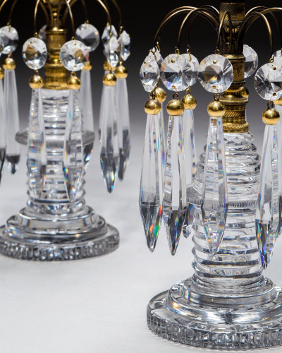 A PAIR OF REGENCY STEP CUT CANDLESTICKS