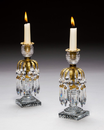 A PAIR OF REGENCY ORMOLU & GLASS CANDLESTICKS
