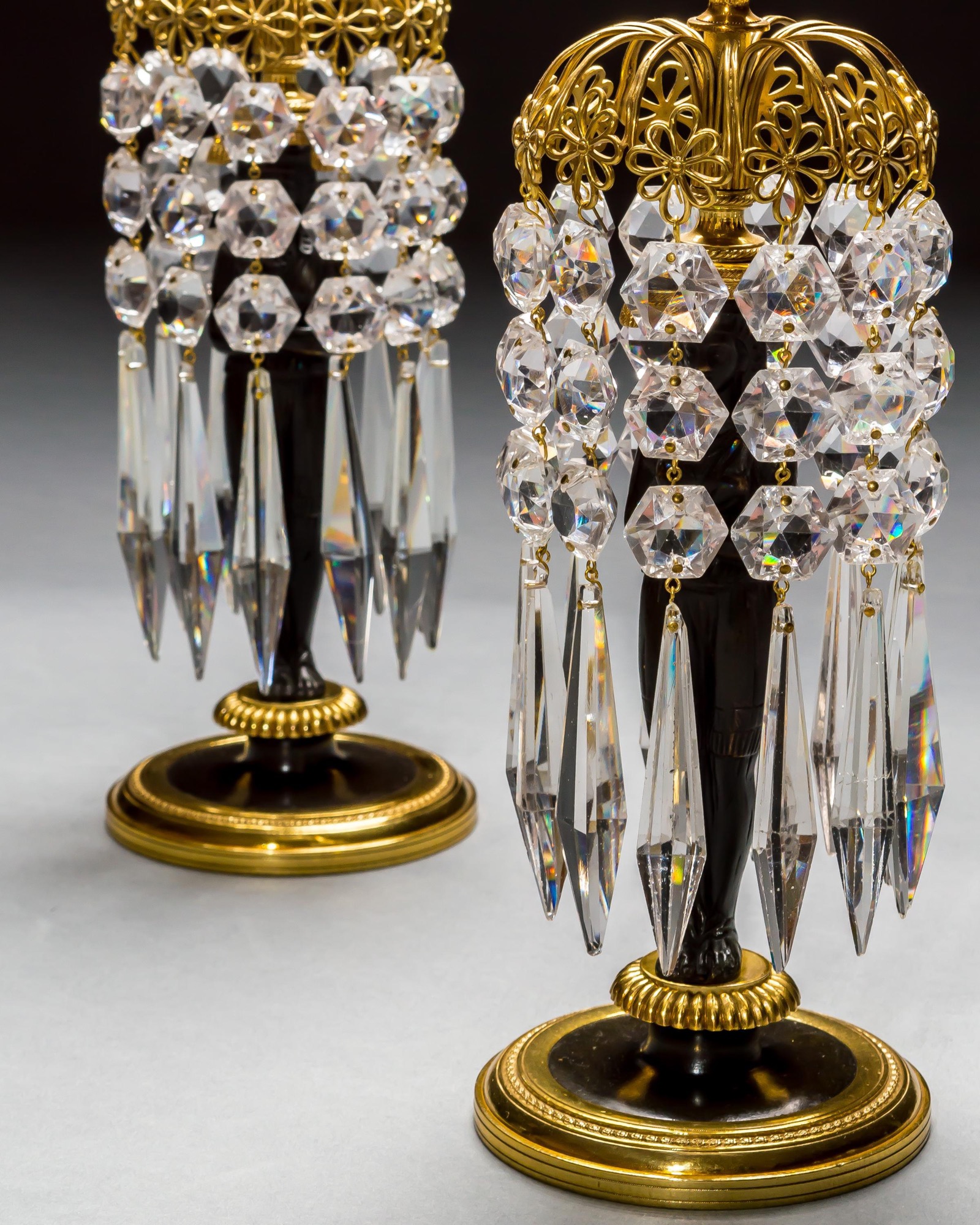 A PAIR OF REGENCY FIGURE CANDLESTICKS