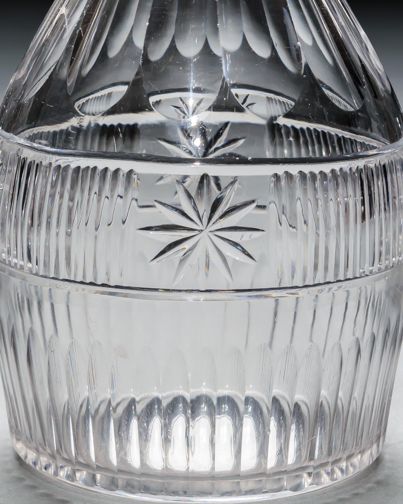 A SET OF THREE SLICE & FLUTE DECANTERS