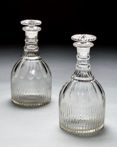 A PAIR OF SLICE & FLUTE DECANTERS