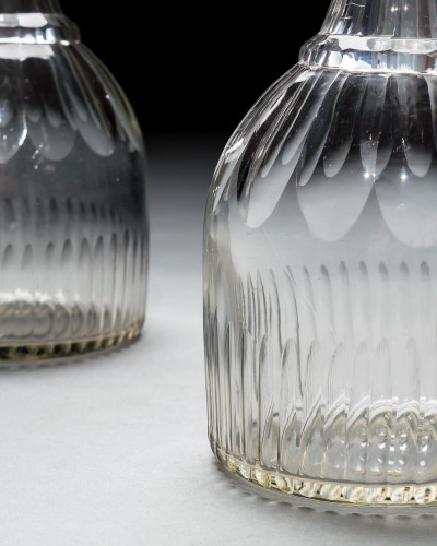 A PAIR OF SLICE & FLUTE DECANTERS