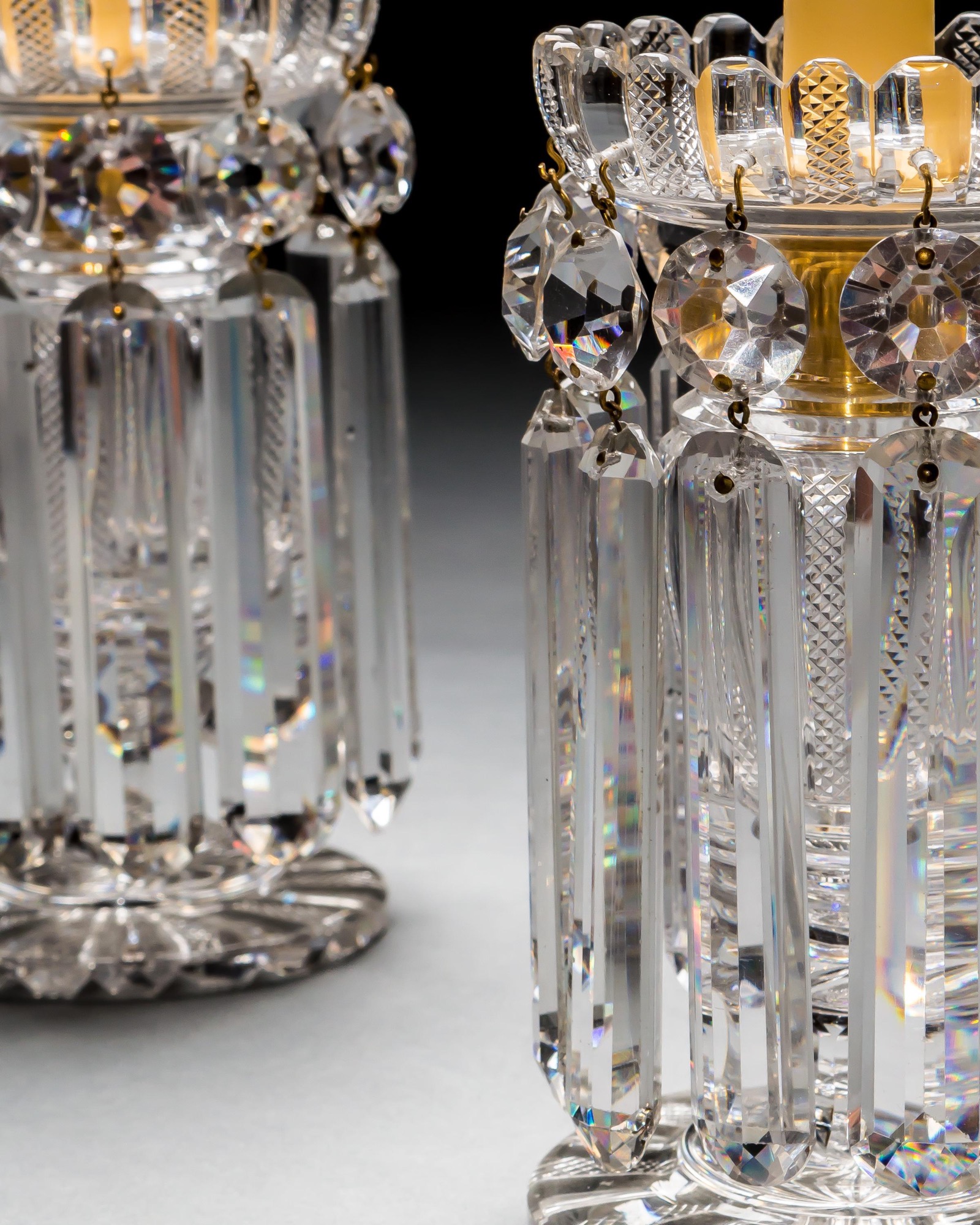 A PAIR OF RICHLY CUT REGENCY LUSTRES BY JOHN BLADES