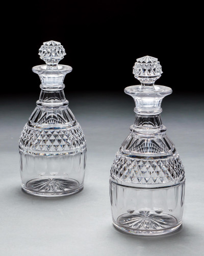 A PAIR OF CUT GLASS GEORGIAN DECANTERS
